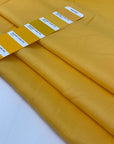 Structured silk and viscose in banana yellow. It is very soft and not transparent. The fabric is structured. High-quality deadstock fabric collected in Stock from a Maison de Couture in Italy.
