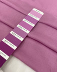 Soft and lightweight pure viscose muslin in pink, color reference Phalaenopsis. Flowy and breathable, ideal for light shirting, dresses, and skirts.High-quality deadstock collected in Stock from a Maison de Couture in Italy.