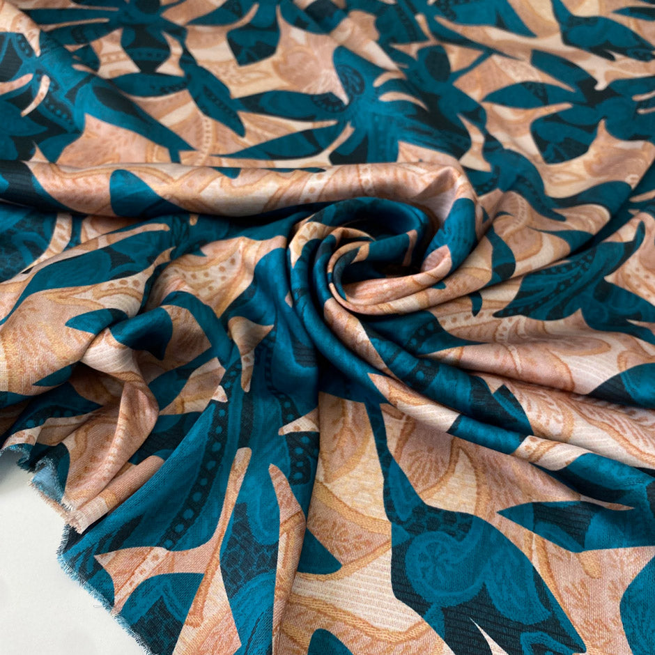 Soft, flowy polyester satin with floral design in otanium and Elmo cream. Not transparent, ideal for dresses, skirts, blouses, and shirting. High-quality deadstock collected in Stock from a Maison de Couture in Italy.