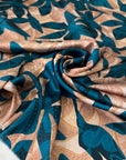 Soft, flowy polyester satin with floral design in otanium and Elmo cream. Not transparent, ideal for dresses, skirts, blouses, and shirting. High-quality deadstock collected in Stock from a Maison de Couture in Italy.