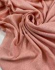 Stretch cotton and linen jersey in pink color reference English Rose. Very flowy and soft with a rough texture. Ideal for t-shirts, sweatshirts, dresses, skirts, and trousers. High-quality deadstock collected in Stock from a Maison de Couture in Italy.