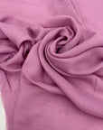 Soft and lightweight pure viscose muslin in pink, color reference Phalaenopsis. Flowy and breathable, ideal for light shirting, dresses, and skirts.High-quality deadstock collected in Stock from a Maison de Couture in Italy.