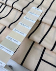 Pure viscose in light peach with a black geometric design. Very soft, flowy, and not transparent. Ideal for dresses, skirts, blouses, and shirting. High-quality deadstock collected in Stock from a Maison de Couture in Italy.