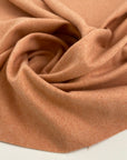 Pink wool flannel fabric, soft and textured. High quality deadstock fabric.