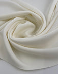White stretch polyester neoprene. High-quality deadstock fabric collected in Stock from a Maison de Couture in Italy.