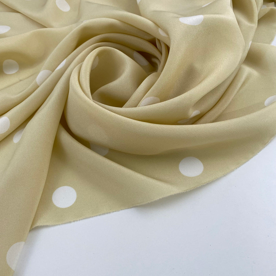 Falling, soft and light polka-dot silk crepe de chine. High quality deadstock fabric.