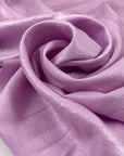 Viscose and polyester light cady, very shiny in orchid violet. Very soft and flowy. High-quality deadstock fabric by the meter collected in Stock from a Maison de Couture in Italy.