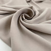 Polyester and elastane cady with textured in white sand, very soft, flowy, and not transparent. High-quality deadstock fabric collected in Stock from a Maison de Couture in Italy. Polyester and elastane cady with textured in white sand, very soft, flowy, and not transparent. High-quality deadstock fabric collected in Stock from a Maison de Couture in Italy.