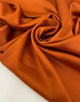 Soft, light, and flowy polyester cady in rust orange with a shiny finish. Not transparent. Perfect for dresses, skirts, blouses, and trousers.
High-quality deadstock collected in Stock from a Maison de Couture in Italy.