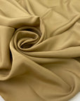 Beige polyester crêpe de chine with a lightweight fluid drape and matte finish ideal for elegant blouses dresses and linings. High-quality deadstock collected in Stock from a Maison de Couture in Italy.