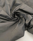 Solid color polyester fabric, textured gray and brown . High-quality deadstock fabric by the meter collected in Stock from a Maison de Couture in Italy.