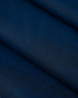 Fresh wool and polyester with blue and black wires. The fabric is soft and falling. High-quality deadstock collected in Stock from a Maison de Couture in Italy.