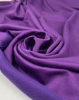 Polyester jersey in violet, very soft, light, and slightly shiny, ideal for dresses, tops, and layering pieces. High-quality deadstock collected in Stock from a Maison de Couture in Italy.