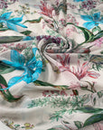 Polyester chiffon printed with floral and leaf design in shades of pink, green, and light blue. Very light, flowy, and transparent. High-quality deadstock collected in Stock from a Maison de Couture in Italy.