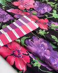 Polyester twill with beautiful flower design. The ground is black and the shades of the flowers are violet, hot pink an,d green. Very soft, light, and flowy. High-quality deadstock fabric by the meter collected in Stock from a Maison de Couture in Italy.