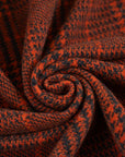 Prince of Wales knit of pure orange wool. The fabric is soft and strecthy. High quality deadstock fabric.