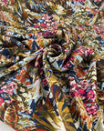 Multicolor polyester twill with beautiful floral design. In dark blue background and red, green, pink, light blue and white shades. Very light high-quality deadstock fabric by the meter collected in Stock from a Maison de Couture in Italy.