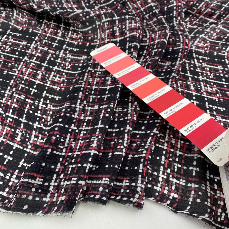 Silk charmeuse fabric, transparent, soft and droopy with a red, black and white geometric print. High quality deadstock fabric collected in Stock from a Maison de Couture in Italy.