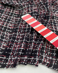 Silk charmeuse fabric, transparent, soft and droopy with a red, black and white geometric print. High quality deadstock fabric collected in Stock from a Maison de Couture in Italy.