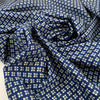 Pure cotton popeline with a blue ground and small flower design in the shades of beige. very soft and light. High-quality deadstock fabric by the meter collected in Stock from a Maison de Couture in Italy. Pure cotton popeline with a blue ground and small flower design in the shades of beige. very soft and light. High-quality deadstock fabric by the meter collected in Stock from a Maison de Couture in Italy.