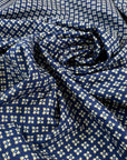 Pure cotton popeline with a blue ground and small flower design in the shades of beige. very soft and light. High-quality deadstock fabric by the meter collected in Stock from a Maison de Couture in Italy.