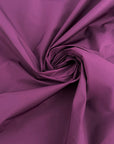 Purple waterproof polyester taffeta, rigid and non-stretch. Perfect for trench. High-quality deadstock collected in Stock from a Maison de Couture in Italy.