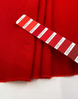 Soft, stretch viscose cady in red. High quality deadstock fabric collected in Stock from a Maison de Couture in Italy.