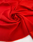 Soft, stretch viscose cady in red. High quality deadstock fabric collected in Stock from a Maison de Couture in Italy.