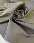 Mixed cotton and polyester denim with diagonal texture in a blend of sage green and bright blue. Medium weight, ideal for trench coats and jackets. High-quality deadstock collected in Stock from a Maison de Couture in Italy.