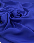 Falling acetate and silk crepe de chine in elettric blue. High-quality deadstock fabric by the meter collected in Stock from a Maison de Couture in Italy.