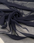 Pure silk chiffon in dark blue. Very light and soft. High-quality deadstock fabric collected in Stock from a Maison de Couture in Italy.