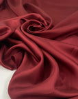 Pure silk twill in dark ruby red. Very soft and not transparent. High-quality deadstock fabric collected in Stock from a Maison de Couture in Italy.