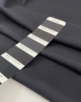 Stretch and falling dark gray silk crepe de chine. High-quality deadstock fabric collected in Stock from a Maison de Couture in Italy.
