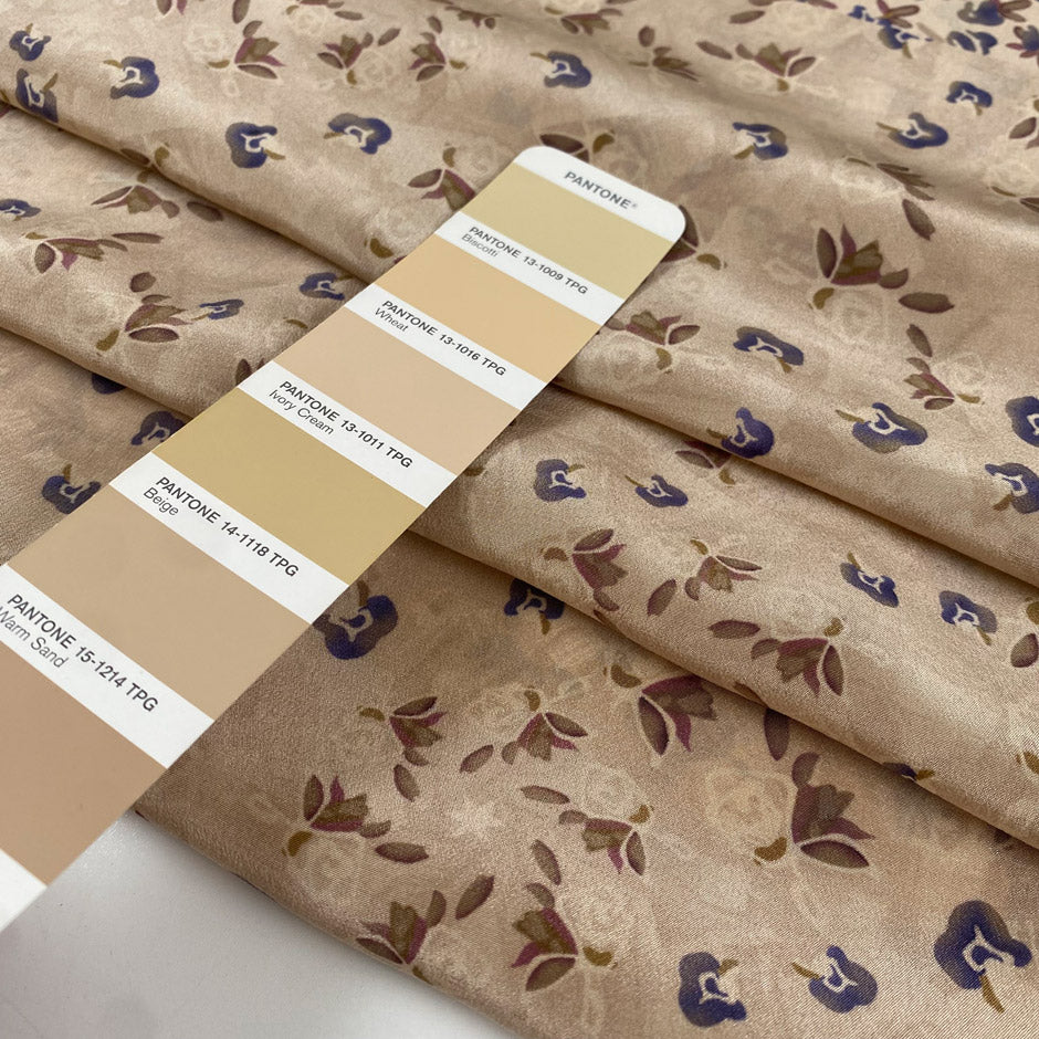 Pure silk crepe de chine in ivory cream ground, with very little floral design in blue and purple shades. Very flowy, light and ideal for shirts, blouses, skirts, and dresses. High-quality deadstock fabric by the meter collected in Stock from a Maison de Couture in Italy.
