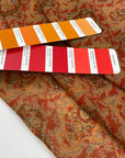Pure silk chiffon with paisly design in paprika red and orange shades. Very soft, light and trasparent. High-quality deadstock fabric by the meter collected in Stock from a Maison de Couture in Italy.
