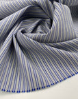 Pure virgin wool fabric with striped pattern, light blue in color. High quality deadstock fabric.