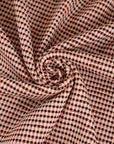 Pink stretch cotton blend summer tweed with black threads. High quality deadstock fabric.