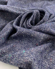 Mixed wool tweed in the shade of blue. High quality deadstock fabric.