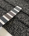 Tweed in polyester wool and viscose blend in smoked pearl grey. Very soft, light, warm and flowy. Ideal for winter dresses, jackets, skirts and light coats. High-quality deadstock collected in Stock from a Maison de Couture in Italy.