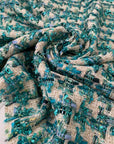 Soft cotton and lurex tweed with an ivory base and turquoise lurex accents in a pied de poule texture. Ideal for jackets, light coats, skirts, and dresses.High-quality deadstock collected in Stock from a Maison de Couture in Italy.