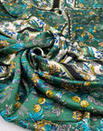 Polyester satin with floral design in panels, in white, green, and olive green shades. Very soft, light, and flowy. High-quality deadstock collected in Stock from a Maison de Couture in Italy.