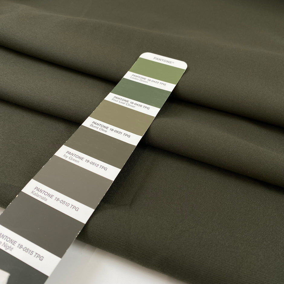 Very soft and flowy viscose/polyester cady in dark olive green, double face and not transparent. High-quality deadstock collected in Stock from a Maison de Couture in Italy.