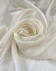 Vanilla ice white and shiny charmeuse polyester; very soft, light, and transparent. High-quality deadstock fabric collected in Stock from a Maison de Couture in Italy.