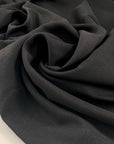 Polyester heavy twill in black, very soft with a shiny effect.