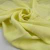 Polyester ligh cady in very bright yellow, very soft, flowy, not transparent. High-quality deadstock fabric collected in Stock from a Maison de Couture in Italy. Polyester ligh cady in very bright yellow, very soft, flowy, not transparent. High-quality deadstock fabric collected in Stock from a Maison de Couture in Italy.