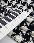 Pure wool with pied de poule design in black and white, color reference Pirate Black and Marshmallow. Heavy and structured, ideal for coats and jackets. High-quality deadstock collected in Stock from a Maison de Couture in Italy.
