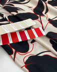 Pure viscose, very soft and light, with beige ground and flower printing in red and black shades. High-quality deadstock fabric by the meter collected in Stock from a Maison de Couture in Italy.