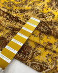 Very soft and light viscose muslin with a paisley design in mustard and brown. Flowy and not transparent, ideal for scarves, light shirting, and airy dresses. High-quality deadstock collected in Stock from a Maison de Couture in Italy.