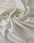 Very soft and light pure cotton batiste in white with delicate stripe design. Ideal for shirting and dresses. High-quality deadstock collected in Stock from a Maison de Couture in Italy.