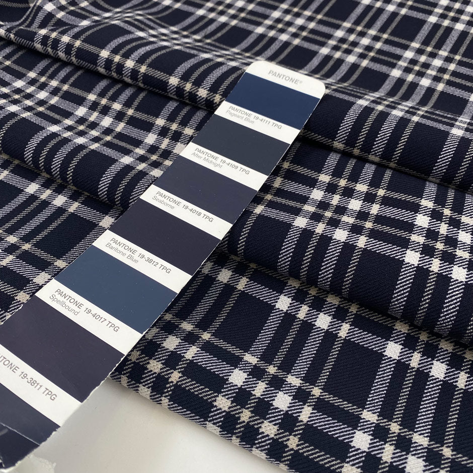Polyester and viscose cady with elastane. Scottish pattern in the shades of dark blue and white. Very soft, double face. High-quality deadstock collected in Stock from a Maison de Couture in Italy.